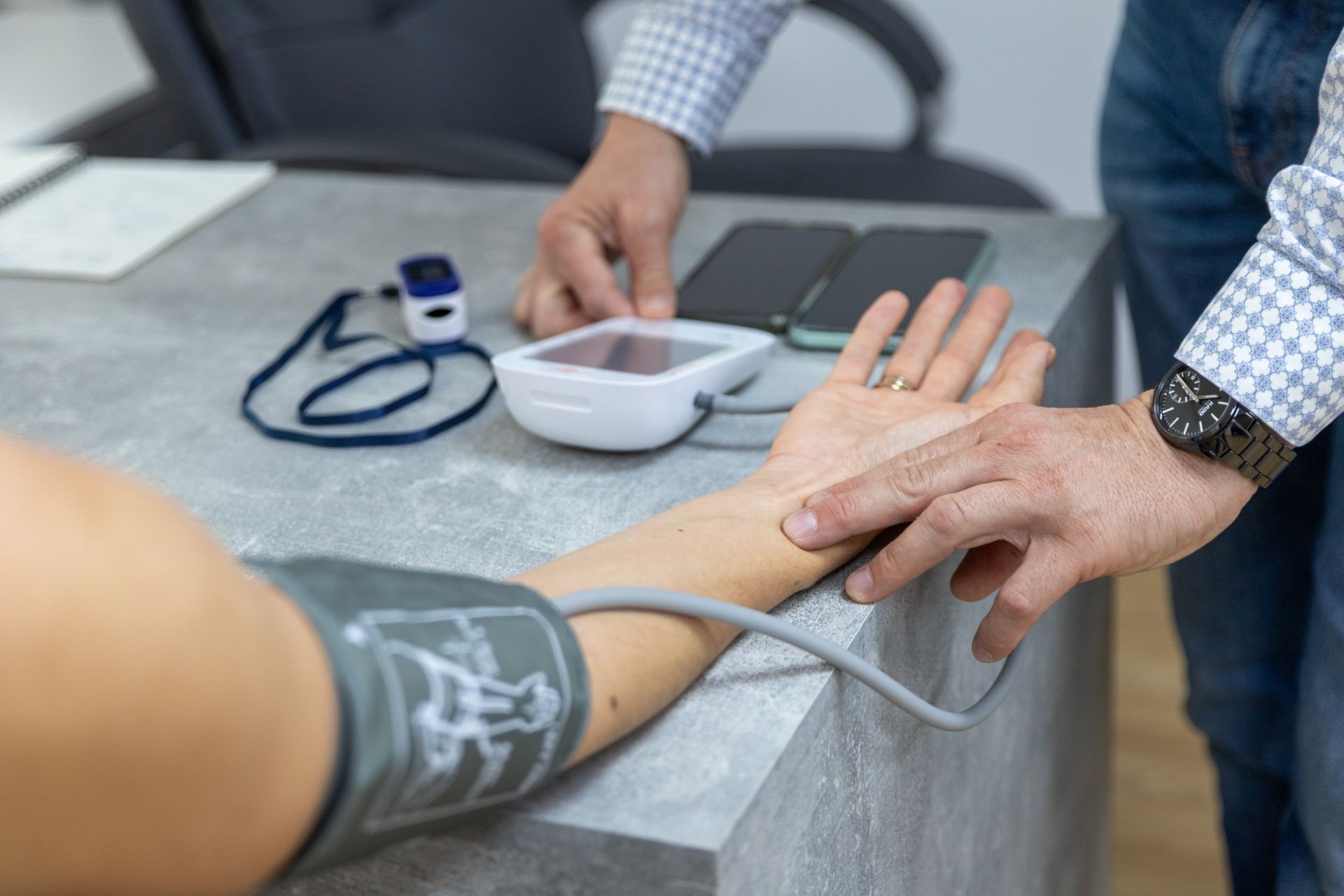 Doctor measuring the patient's blood pressure